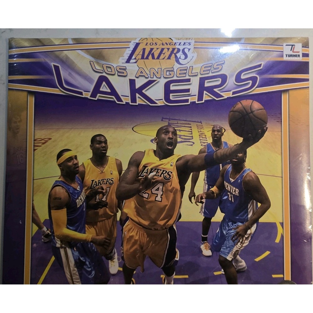 Sealed 2011 Los Angeles Lakers team calendar featuring action photos of players